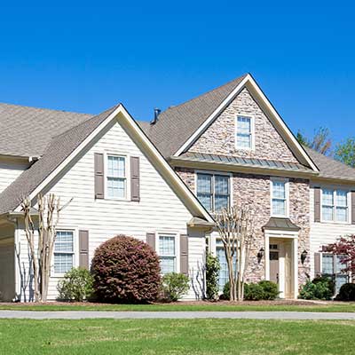 Front view of a light-colored mid-class home